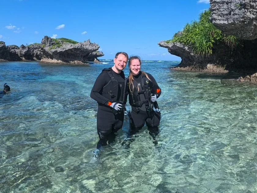 Wading in off a quiet Kerama shoreline to snorkel